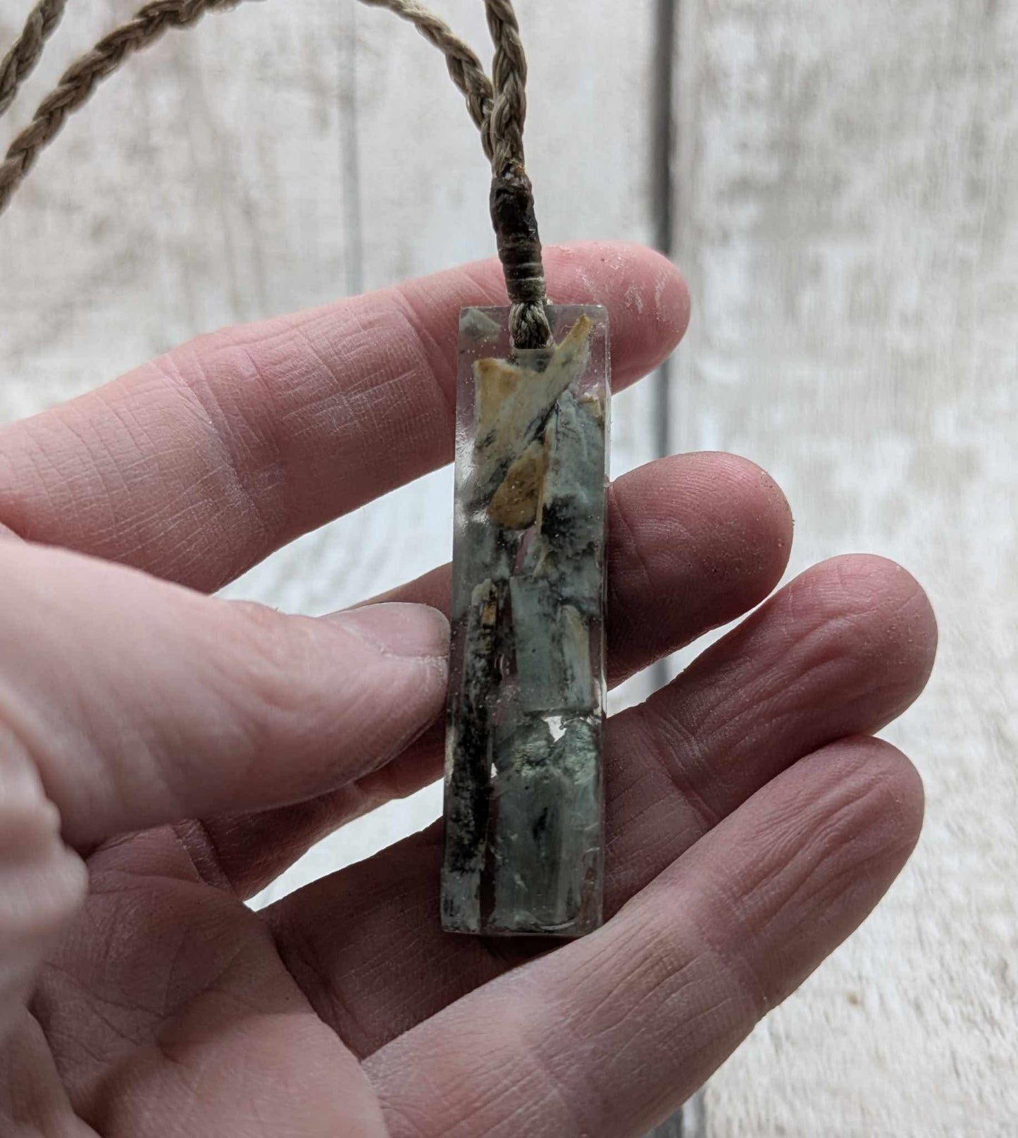 New Zealand Pounamu greenstone chip pendant in Uv resin casting.