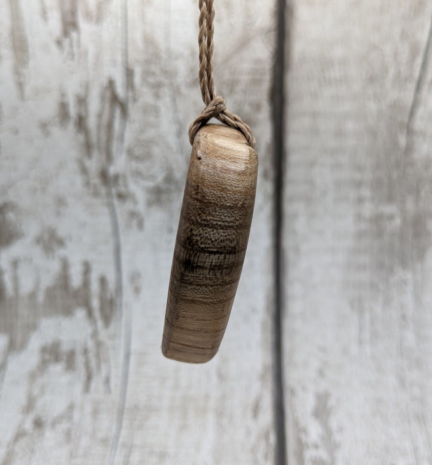 Birch wood Koru heart carved pendant.