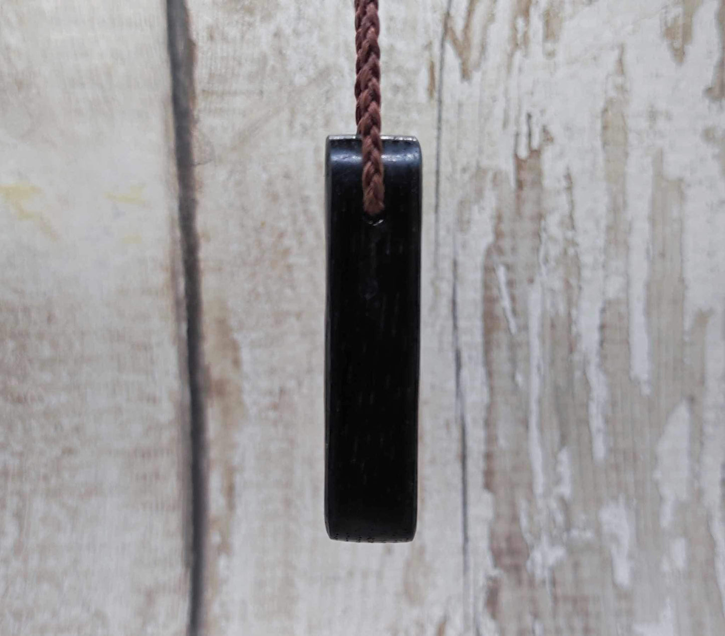 Bog oak and moldavite glass,