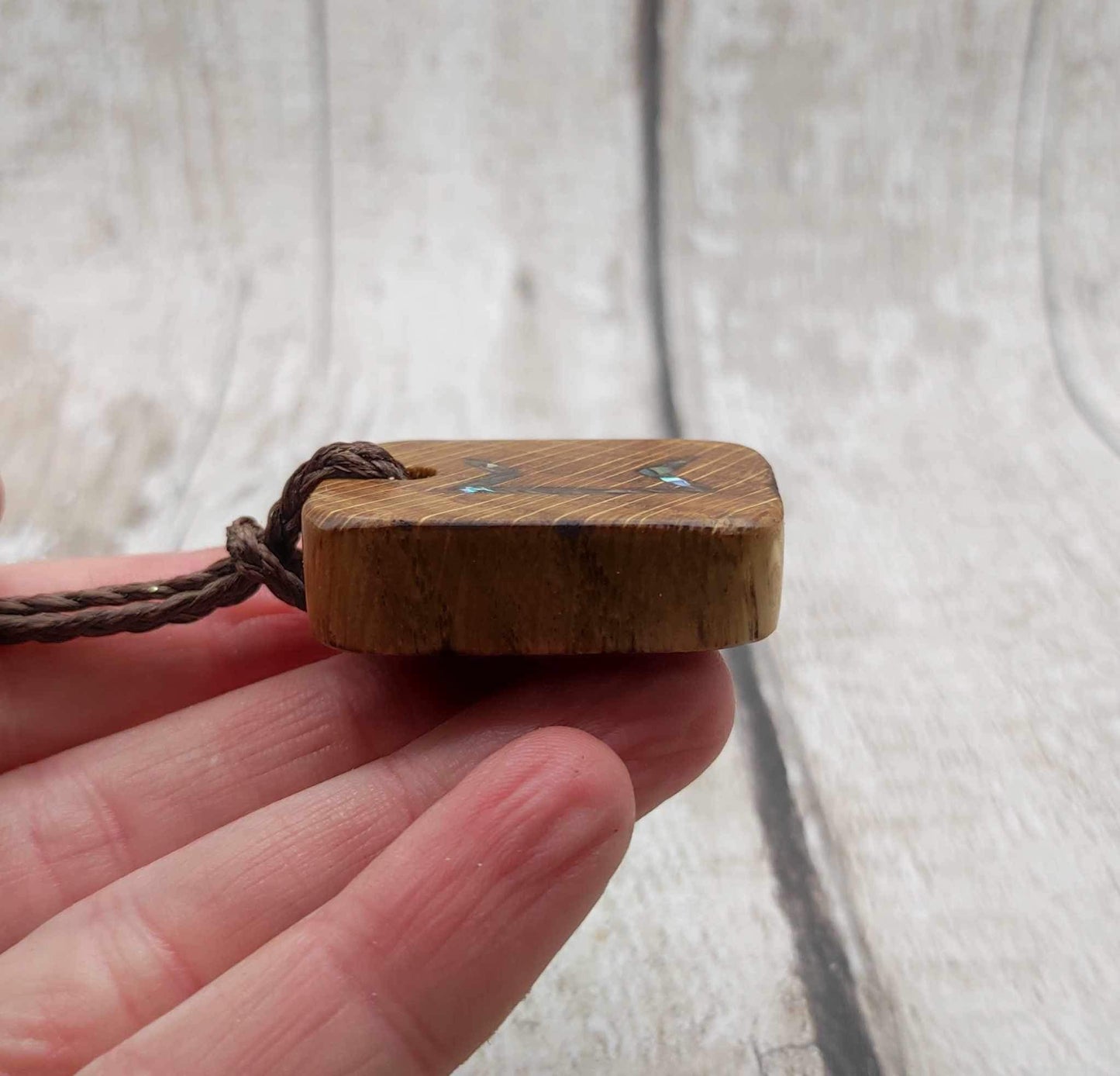 Perthro oak wood rune Christmas decoration with Pāua shell inlay.