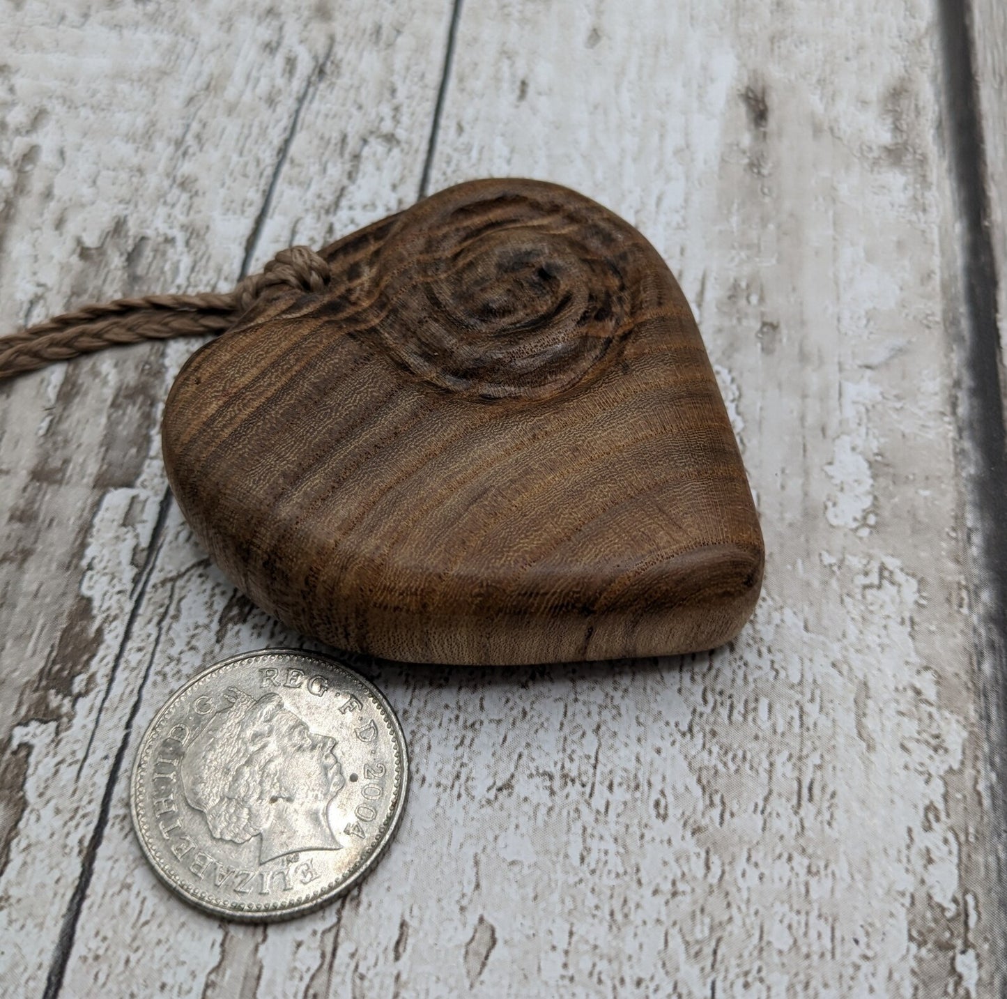 Birch wood Koru heart carved pendant.