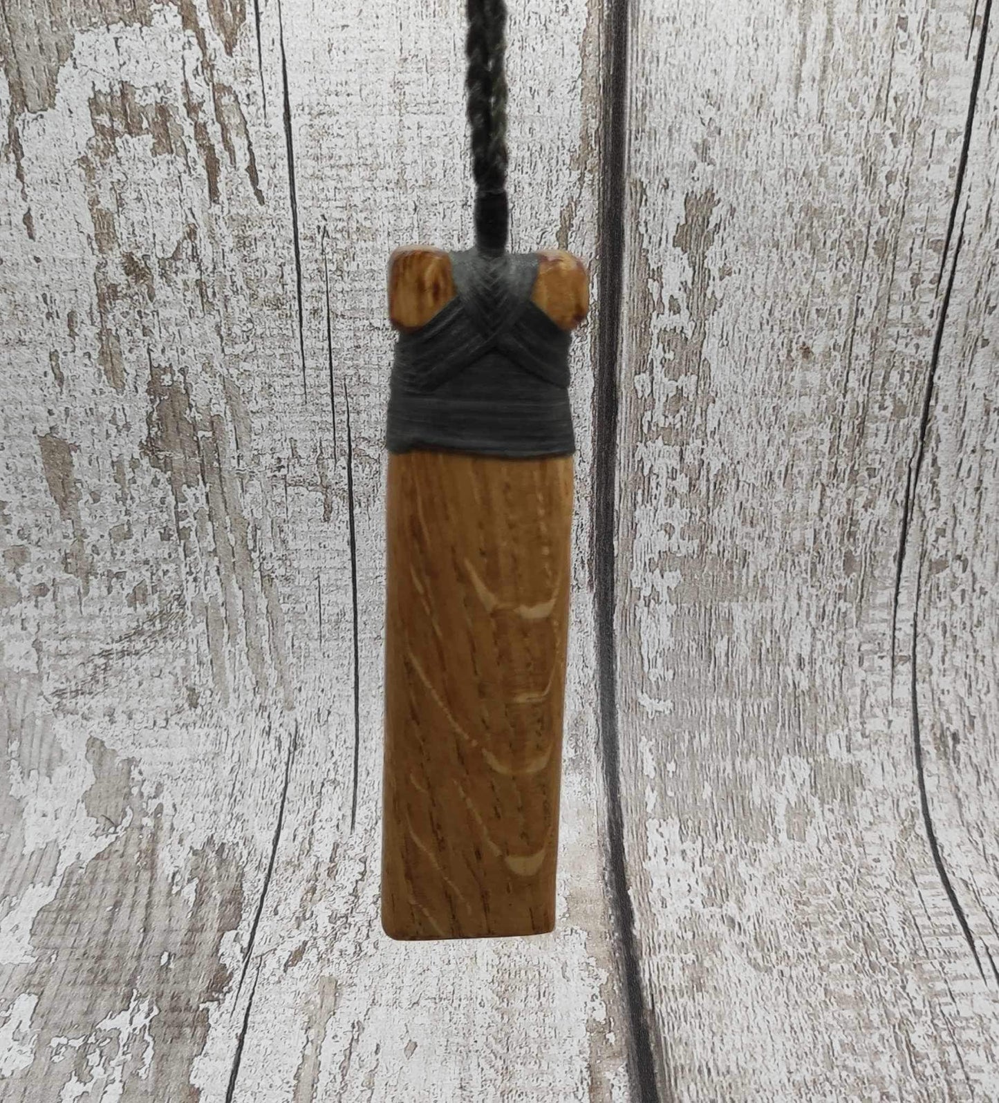 Oak wood statement Hei Toki adze pendant with blue kyanite inlay.