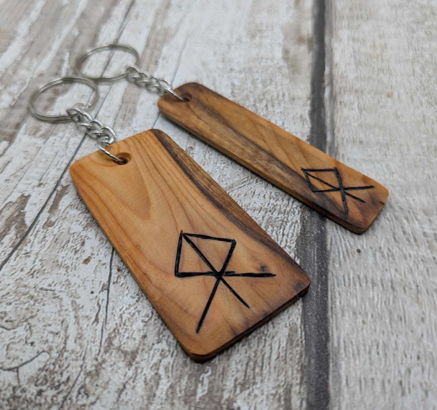 Yew wood protection bind rune keyring.