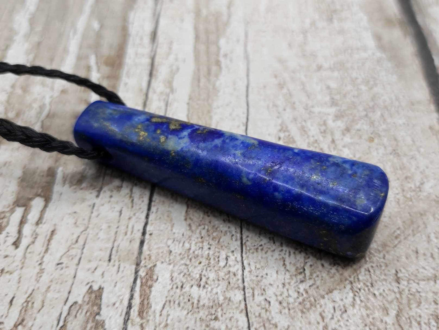 Lapis lazuli roimata drop stone pendant.