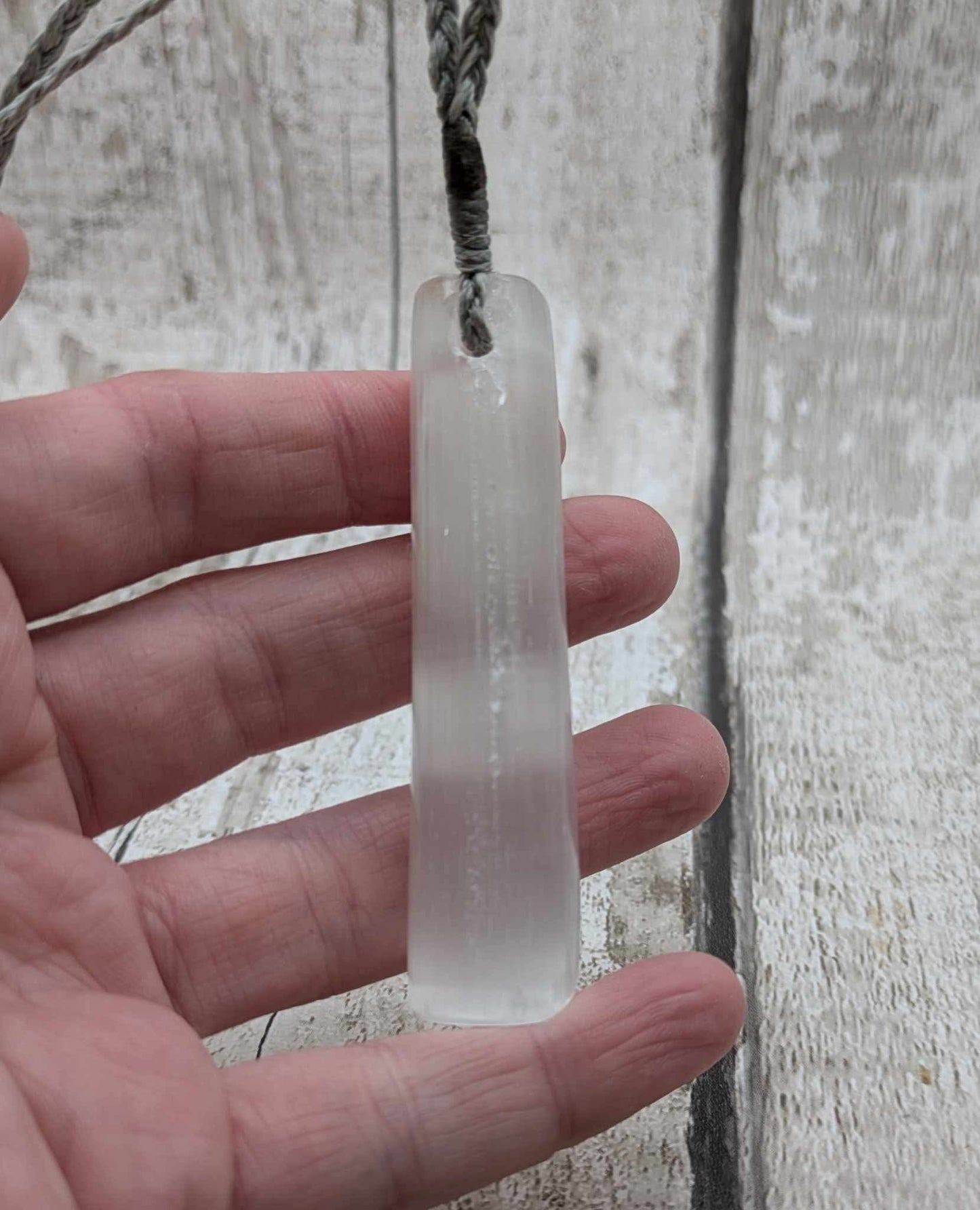 Selenite satin spar Toki pendant.
