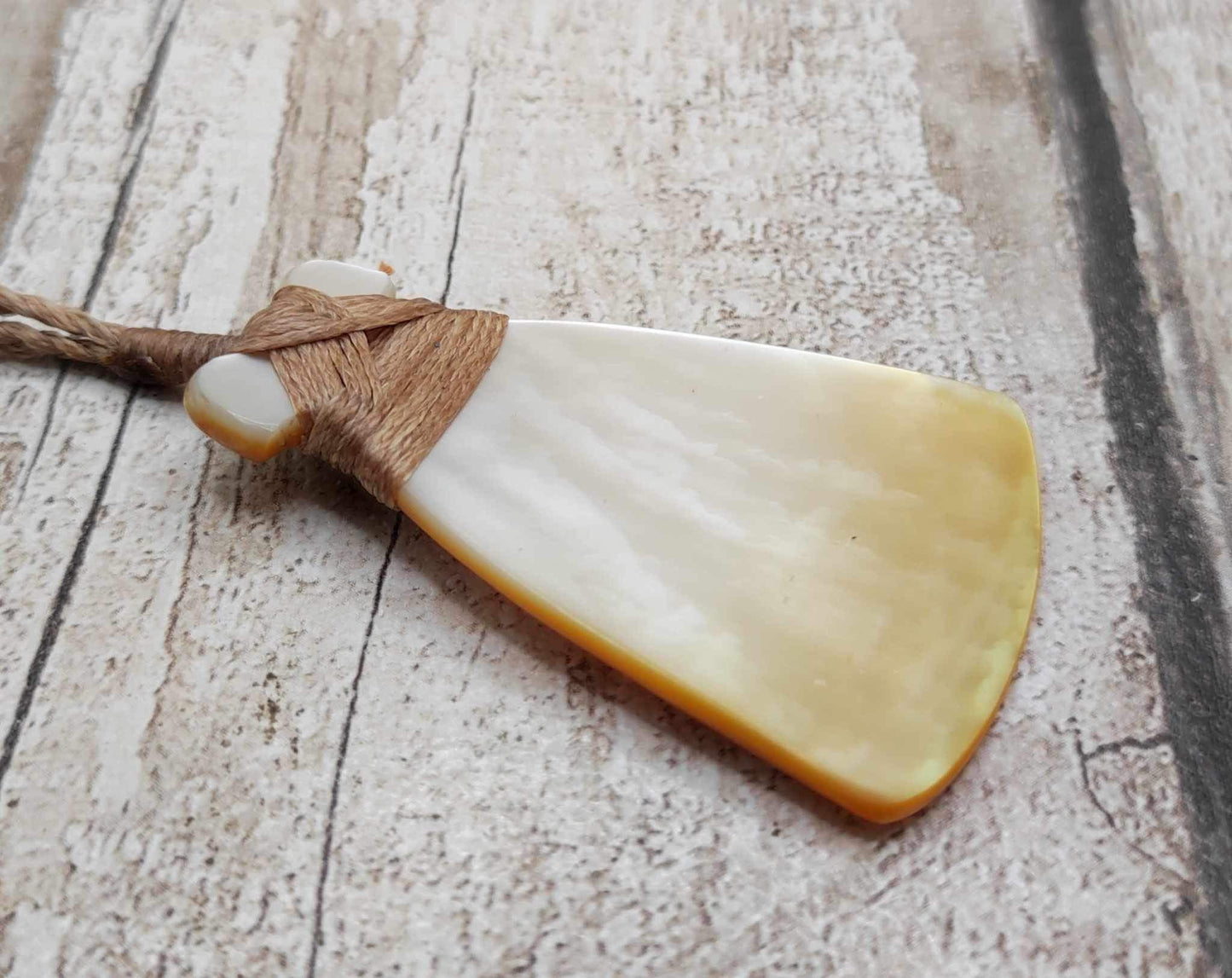 Mother of Pearl Hei Toki adze pendant.