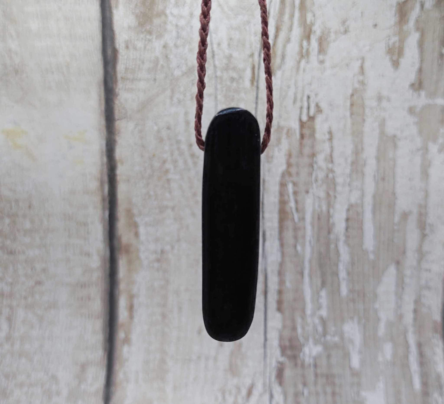 Bog oak and moldavite glass,