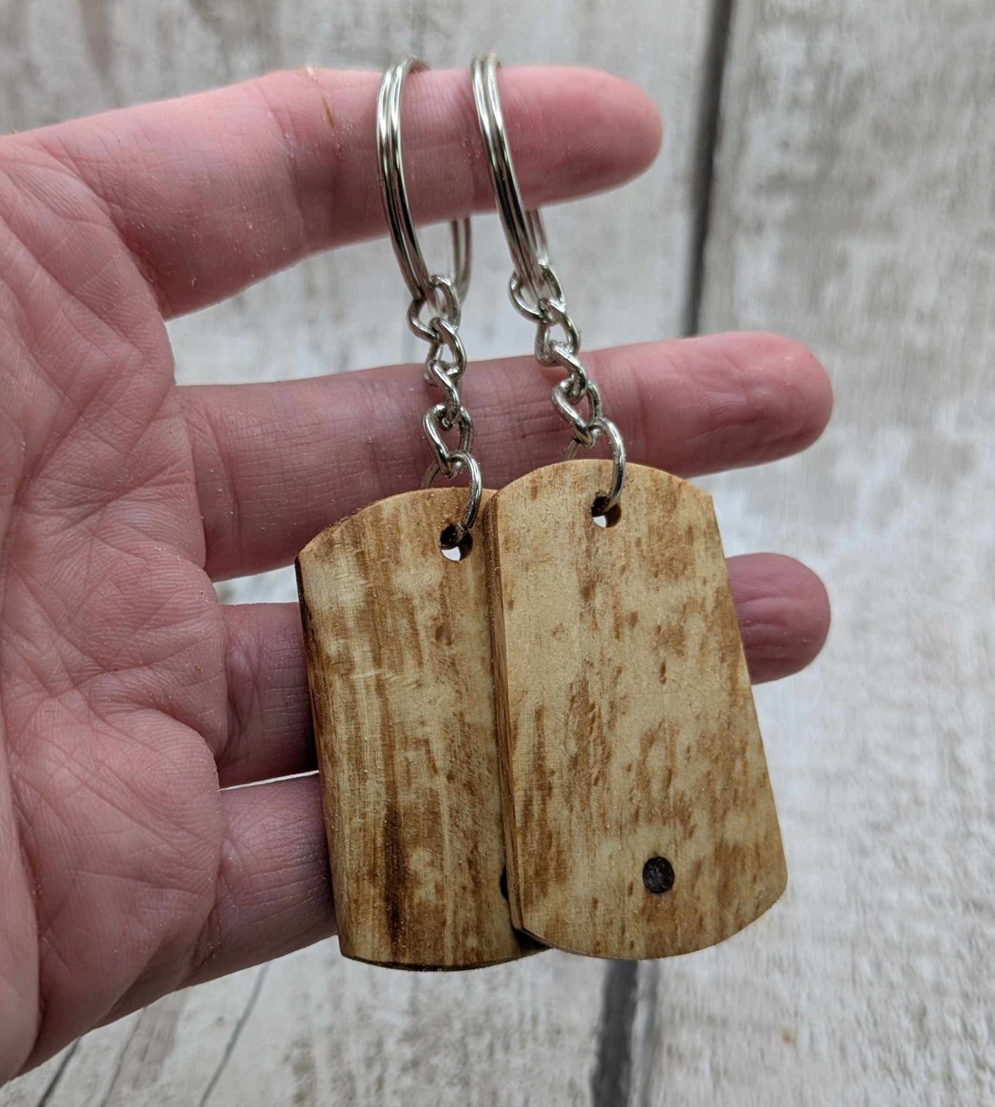 Beech wood keyrings and blue kyanite inlay.
