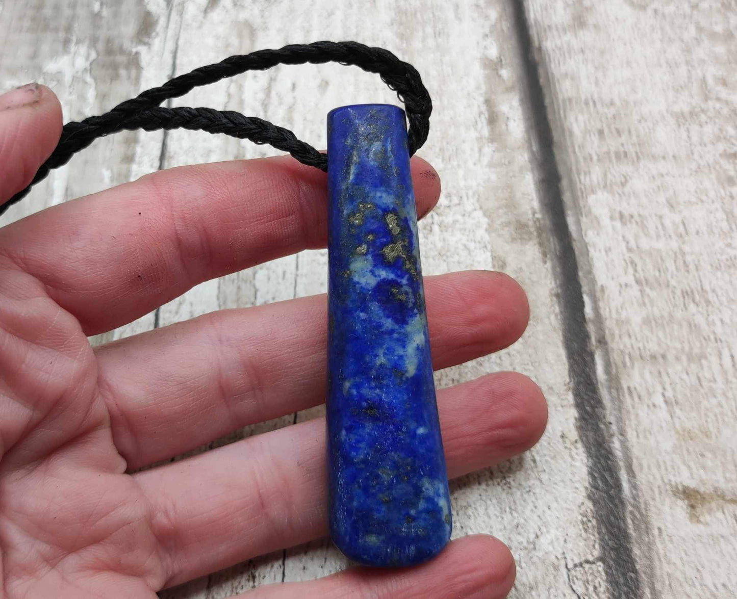Lapis lazuli roimata drop stone pendant.