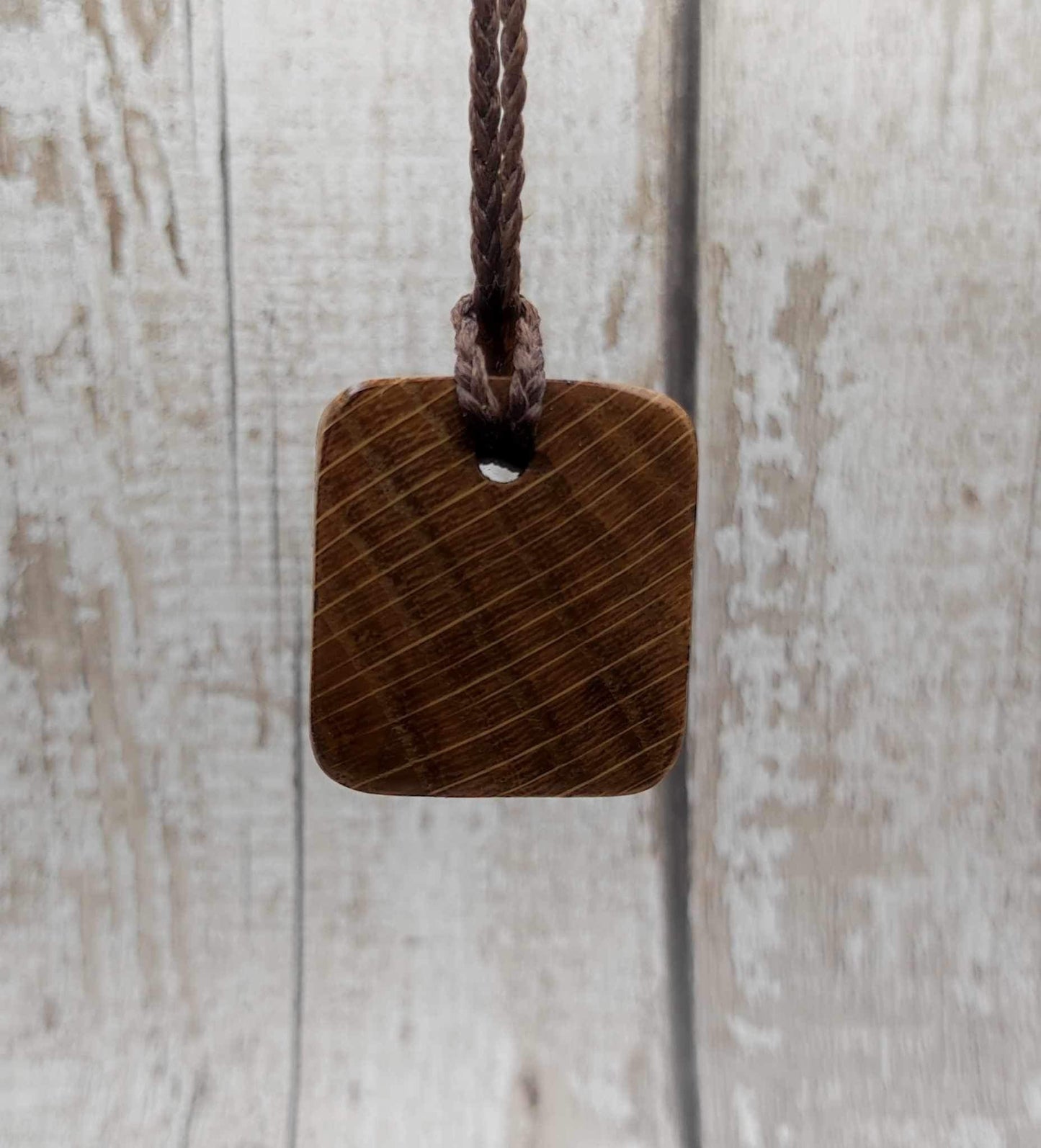 Perthro oak wood rune Christmas decoration with Pāua shell inlay.
