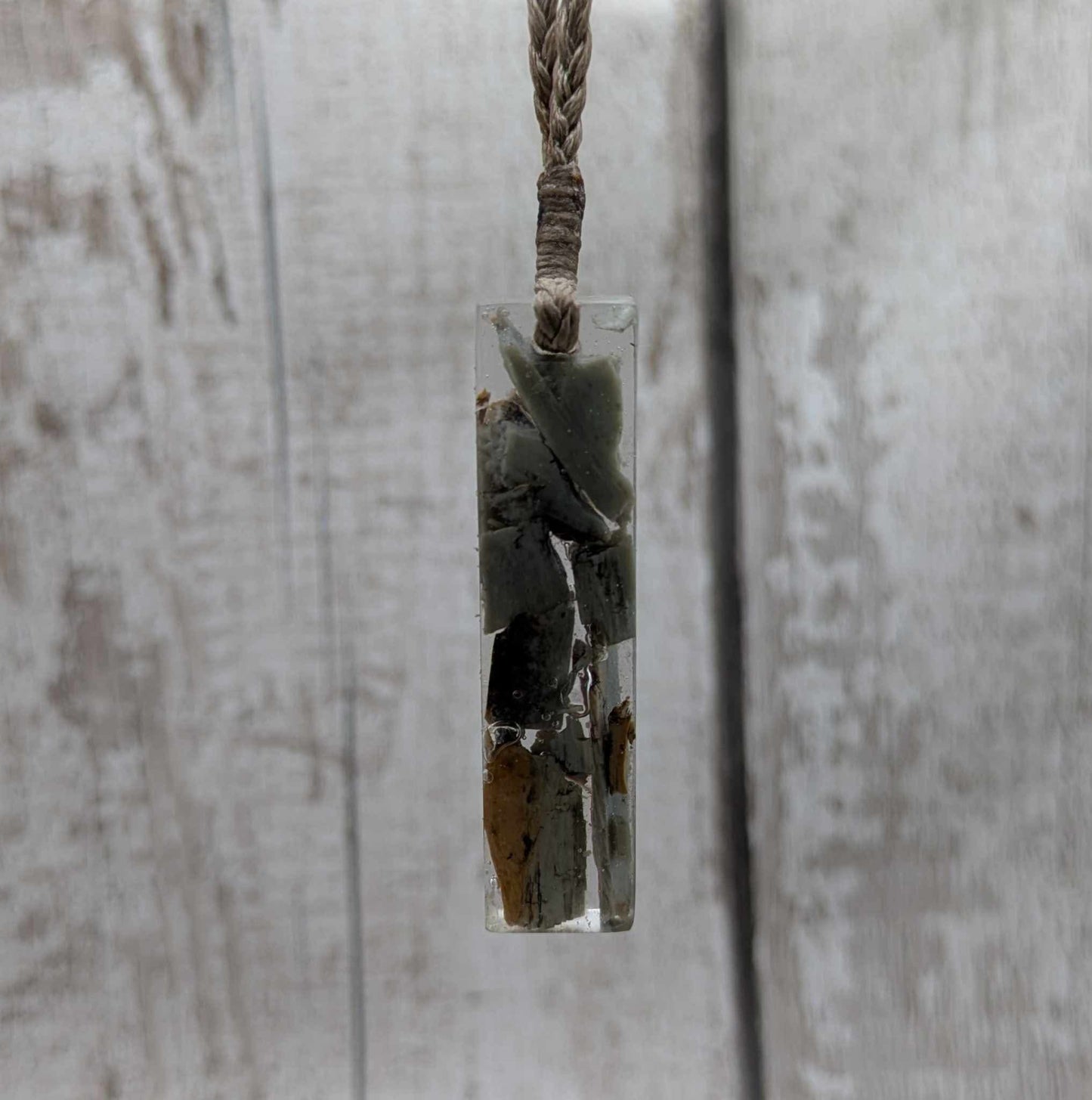 New Zealand Pounamu greenstone chip pendant in Uv resin casting.