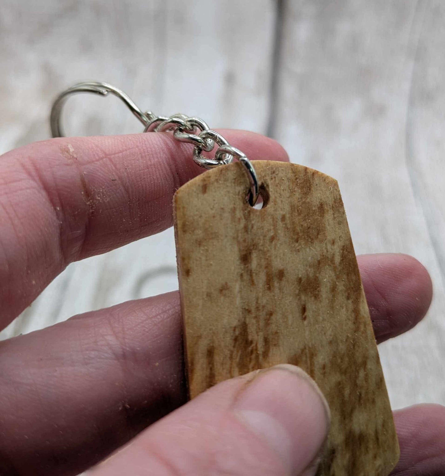 Beech wood keyrings and blue kyanite inlay.
