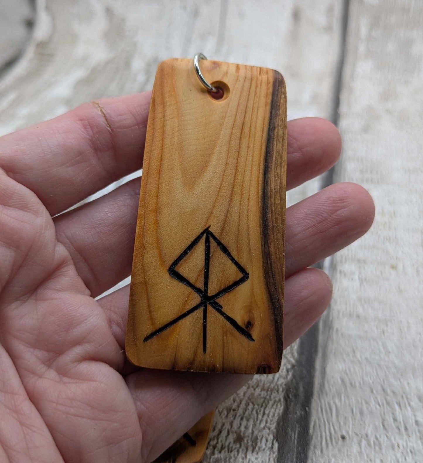 Yew wood protection bind rune keyring.