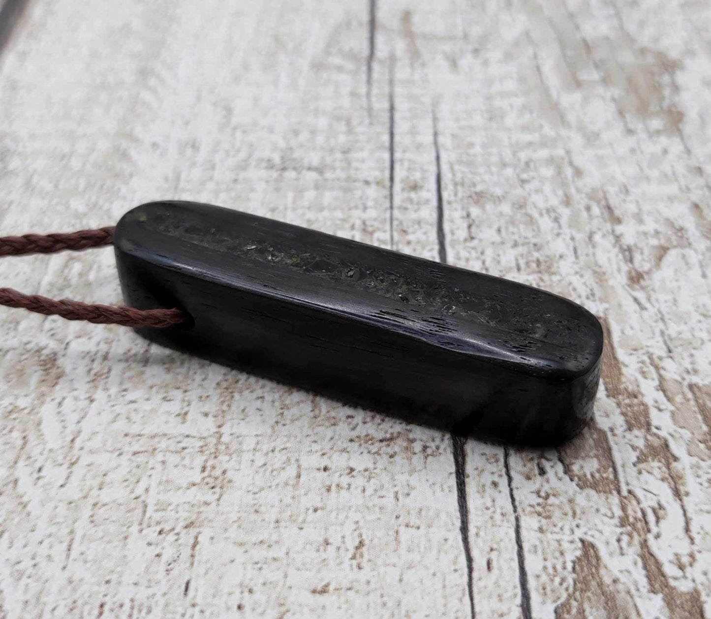 Bog oak and moldavite glass,