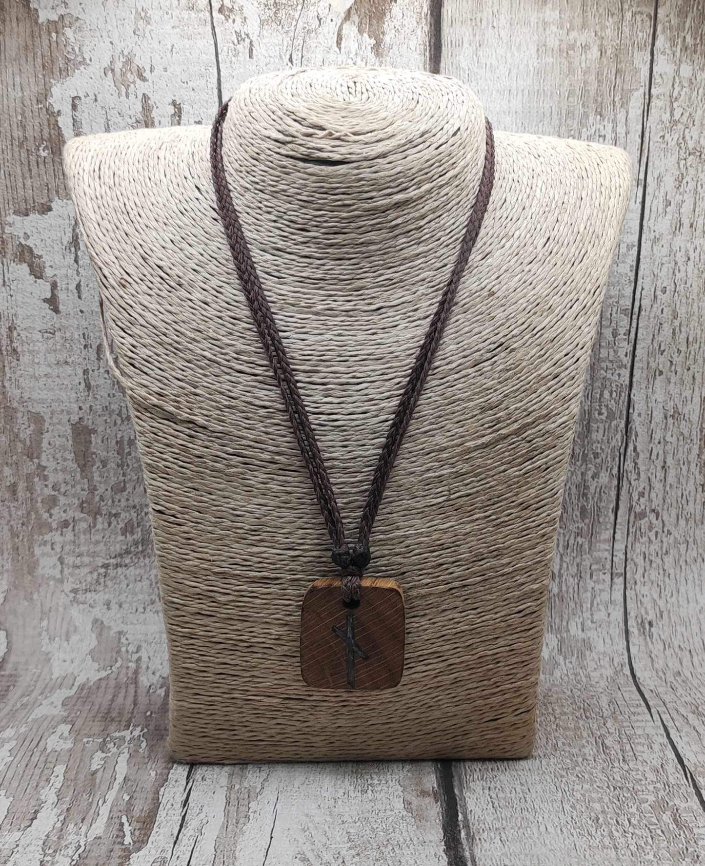 Nauthiz oak rune pendant with blue kyanite inlay.