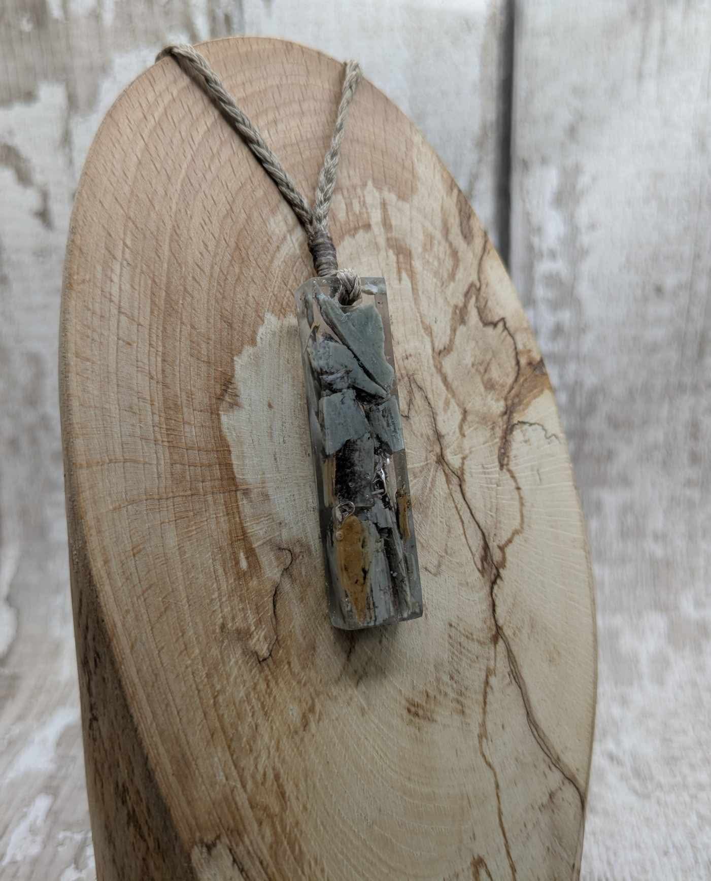 New Zealand Pounamu greenstone chip pendant in Uv resin casting.