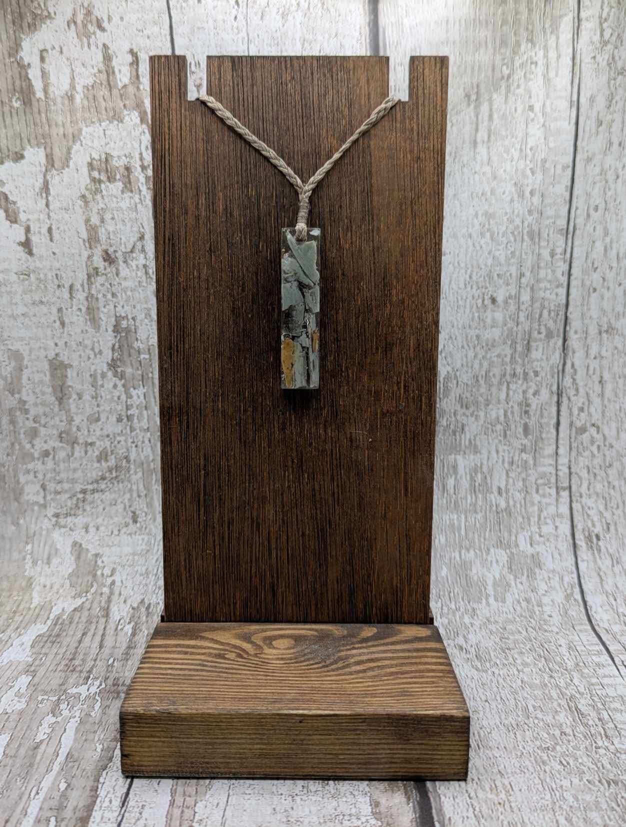 New Zealand Pounamu greenstone chip pendant in Uv resin casting.