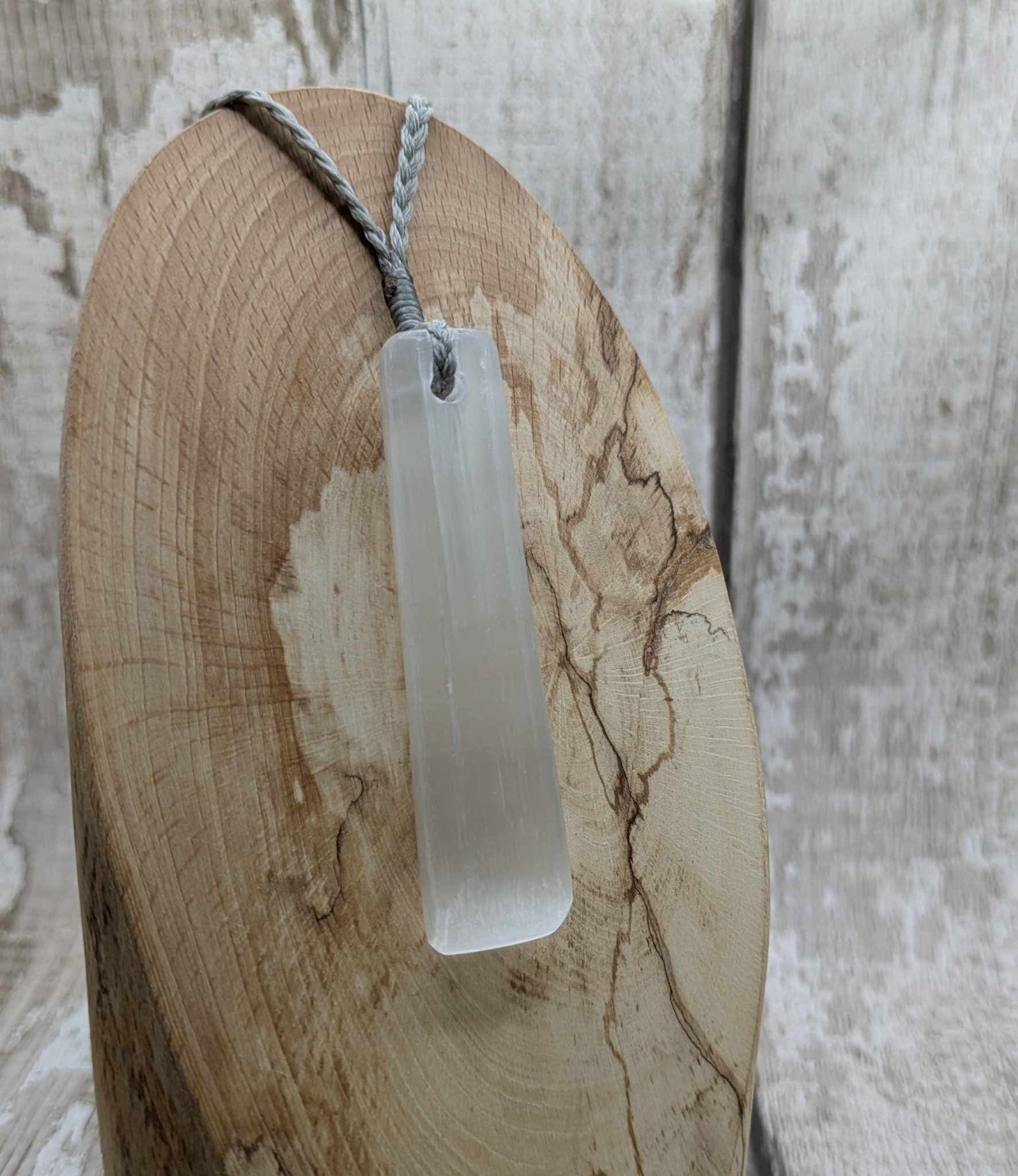 Selenite satin spar Toki pendant.