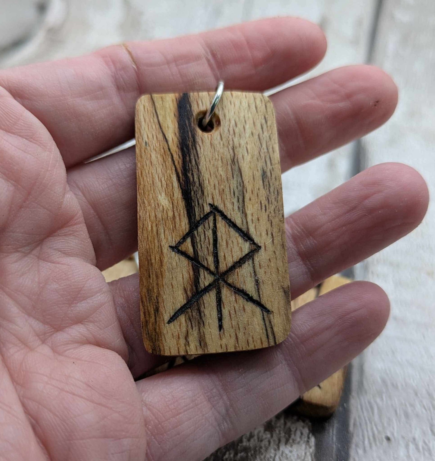 Spalted beech wood protection bind rune keyring.