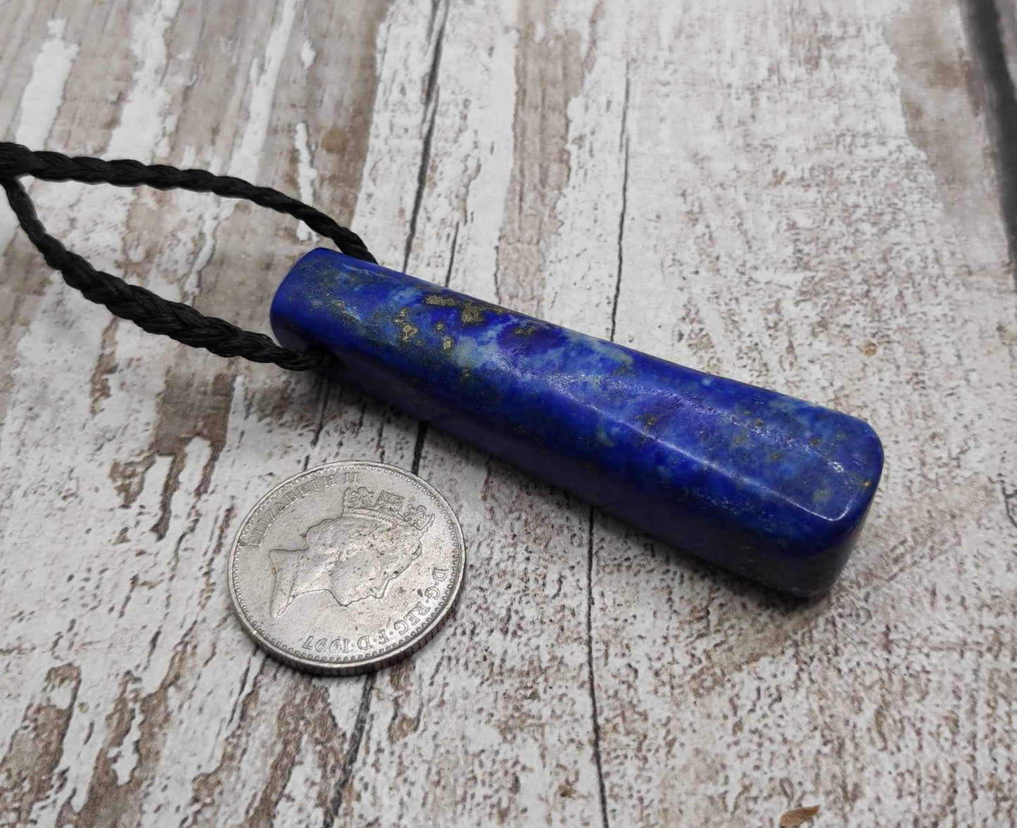 Lapis lazuli roimata drop stone pendant.