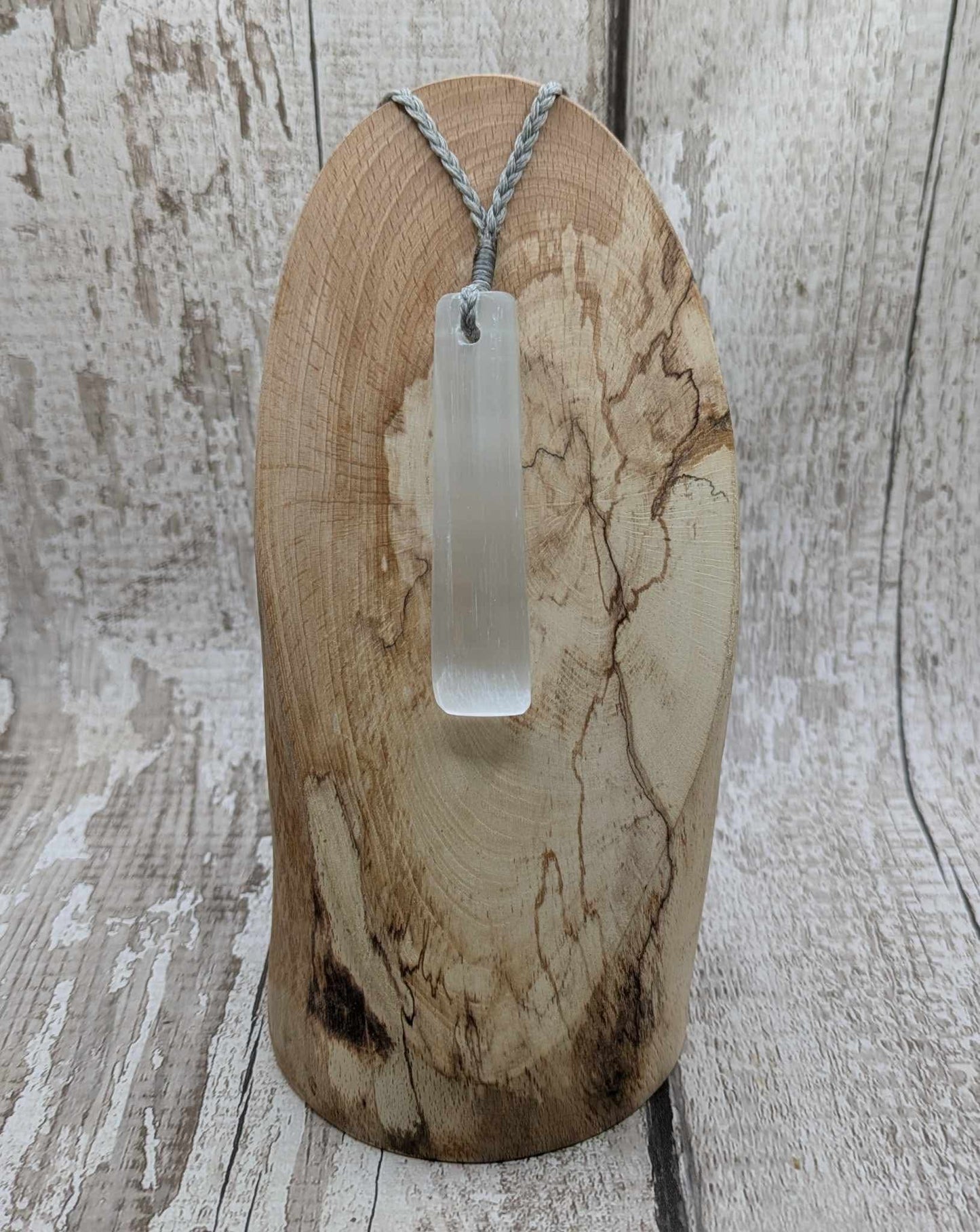 Selenite satin spar Toki pendant.