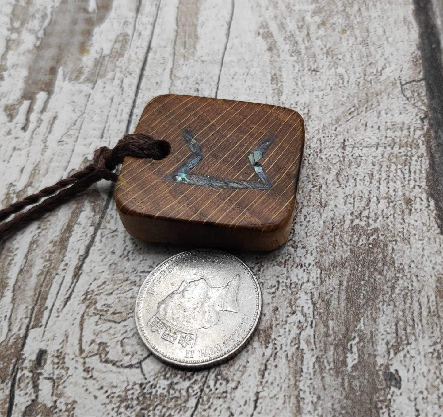 Perthro oak wood rune Christmas decoration with Pāua shell inlay.