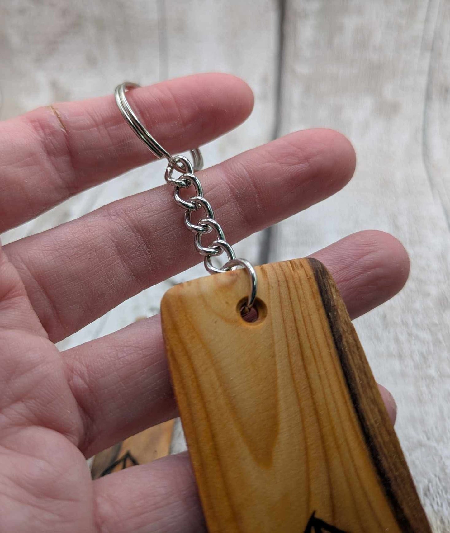 Yew wood protection bind rune keyring.