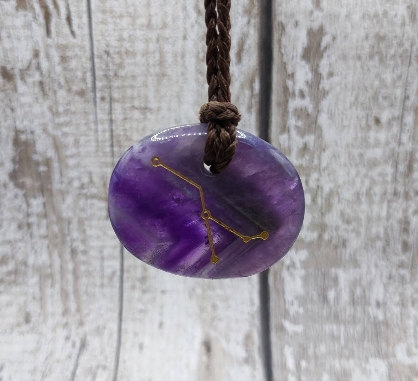 Cancer star sign amethyst drilled palm stone pendant.