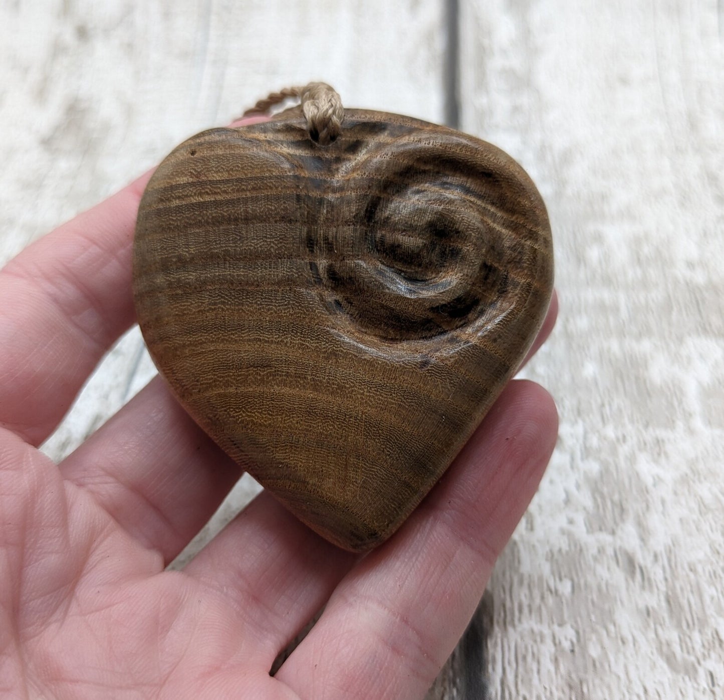 Birch wood Koru heart carved pendant.