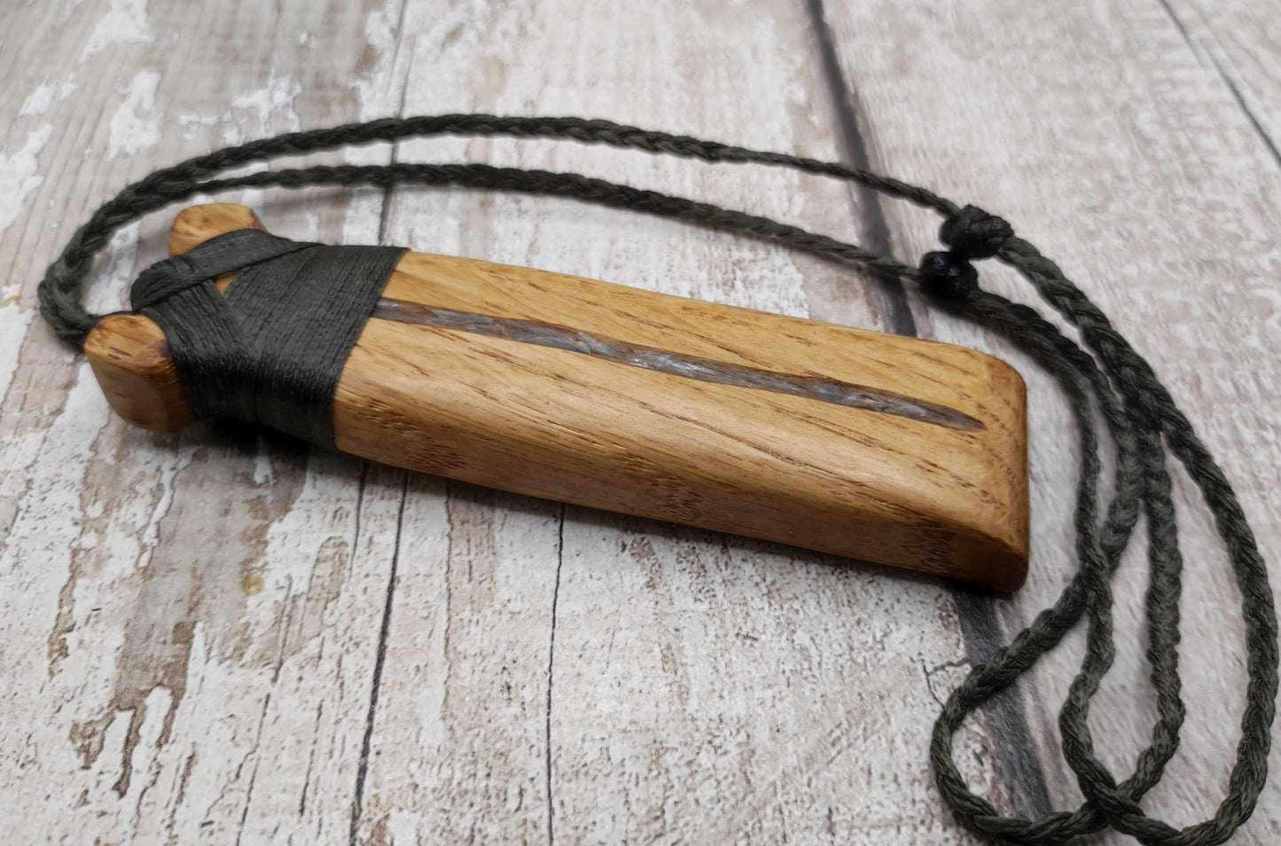 Oak wood statement Hei Toki adze pendant with blue kyanite inlay.