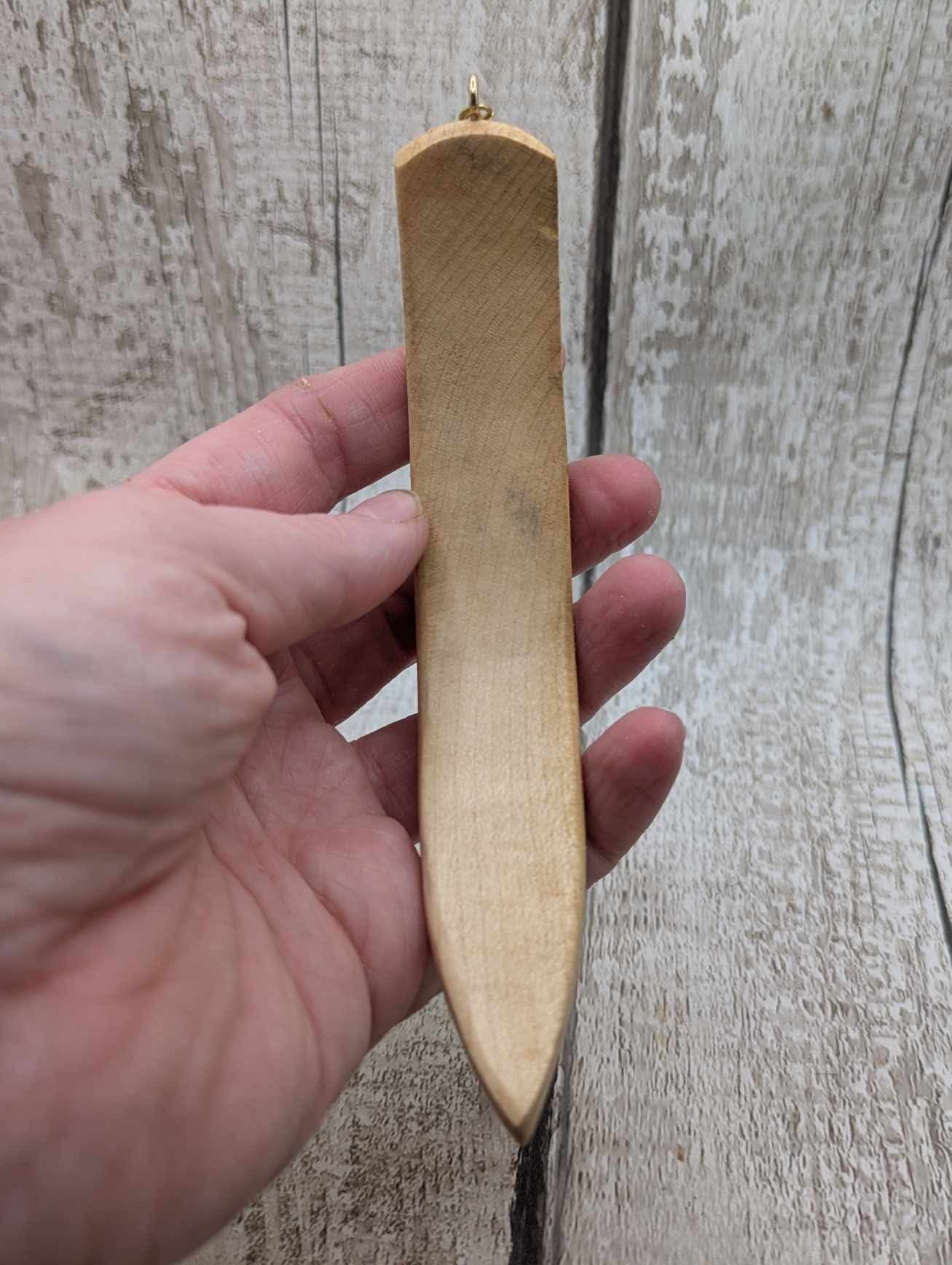 Ash wood curved hair stick with goldstone charm.