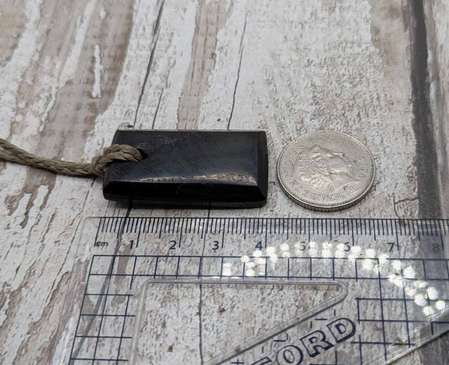 Sea coal rectangular pendant.