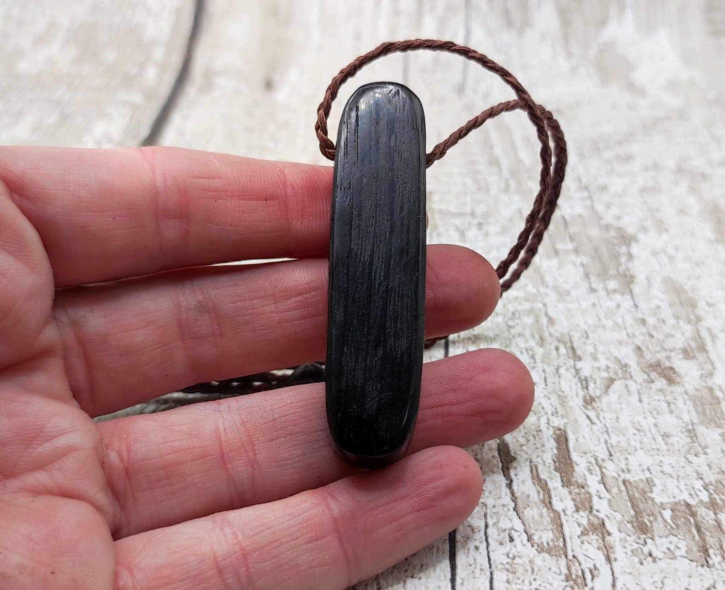Bog oak and moldavite glass,
