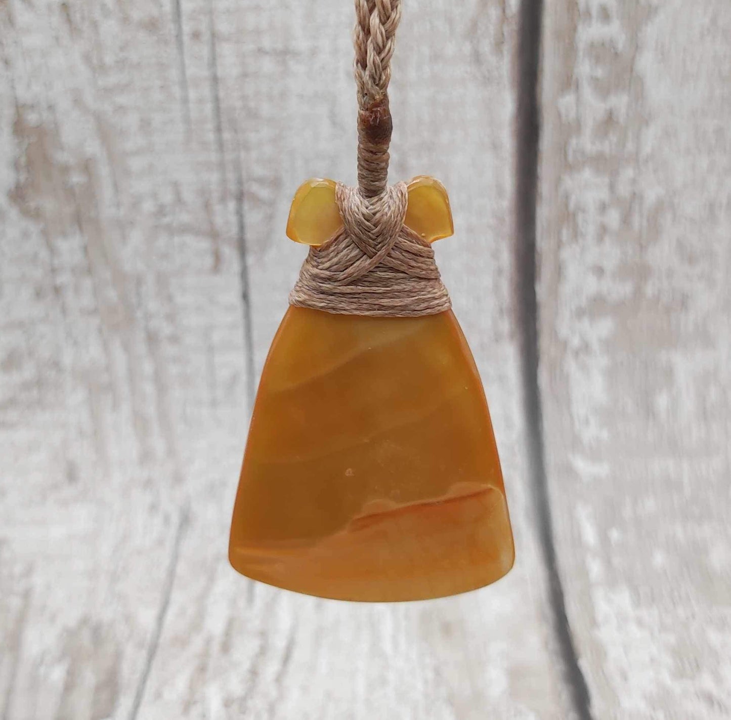 Mother of Pearl Hei Toki adze pendant.