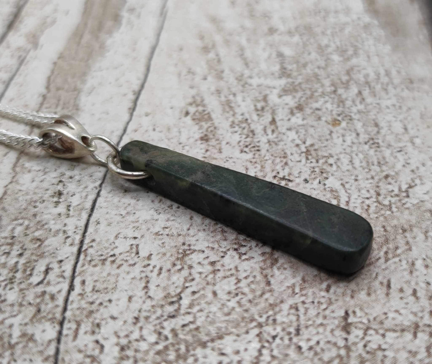 New Zealand Pounamu Greenstone serpentine, roimata drop on silver pendant.
