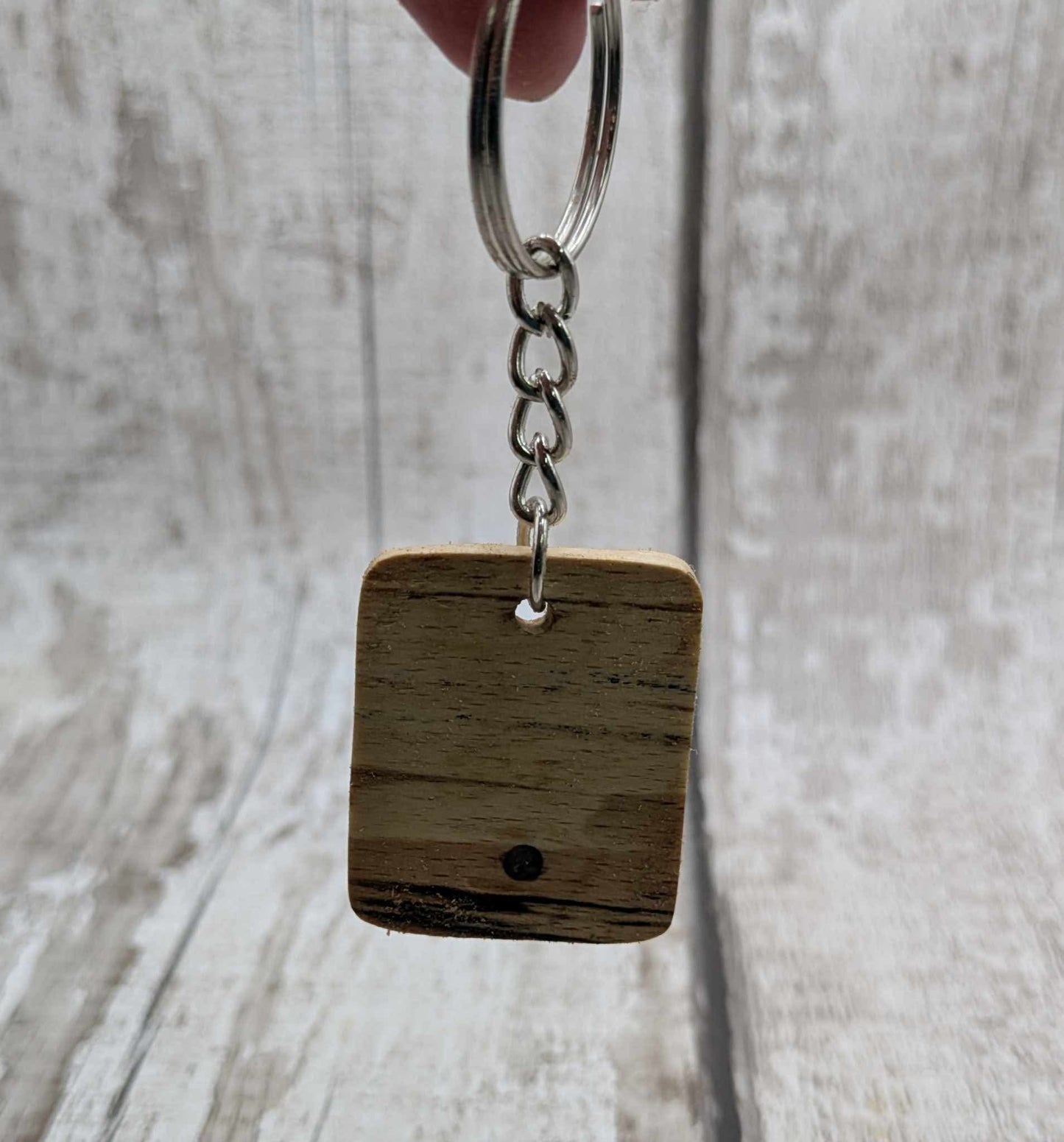 Beech wood keyring with blue kyanite inlay.