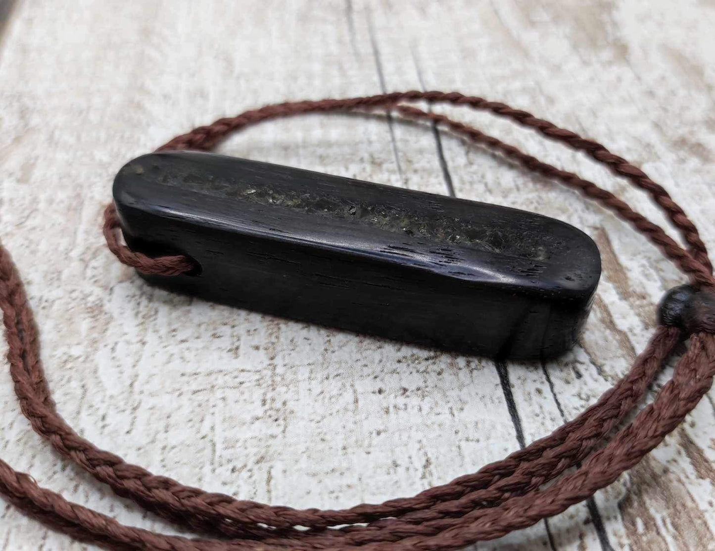 Bog oak and moldavite glass,