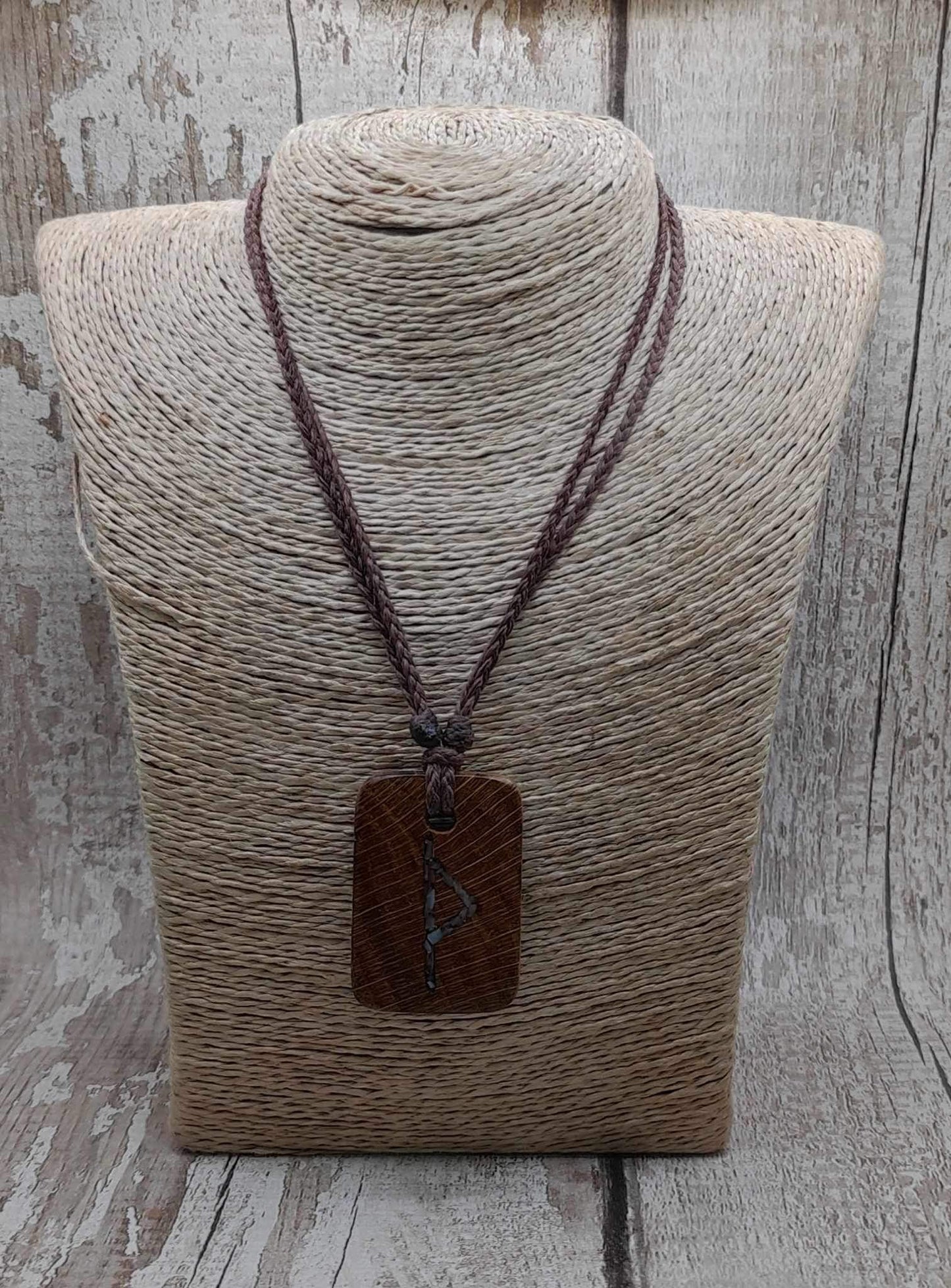 Wunjo oak wood rune pendant with mussel shell inlay.
