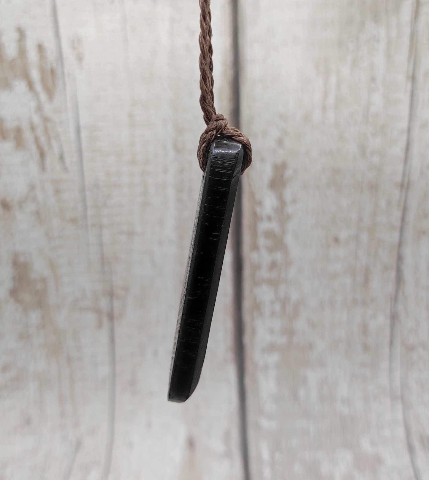 Bog oak hand carved Hei Toki adze unisex pendant.