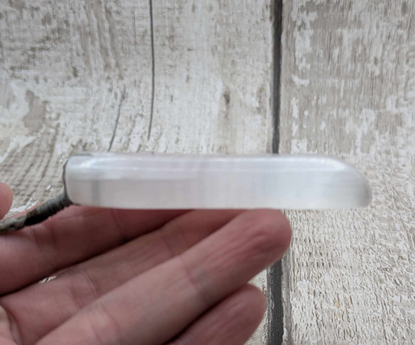 Selenite satin spar Toki pendant.