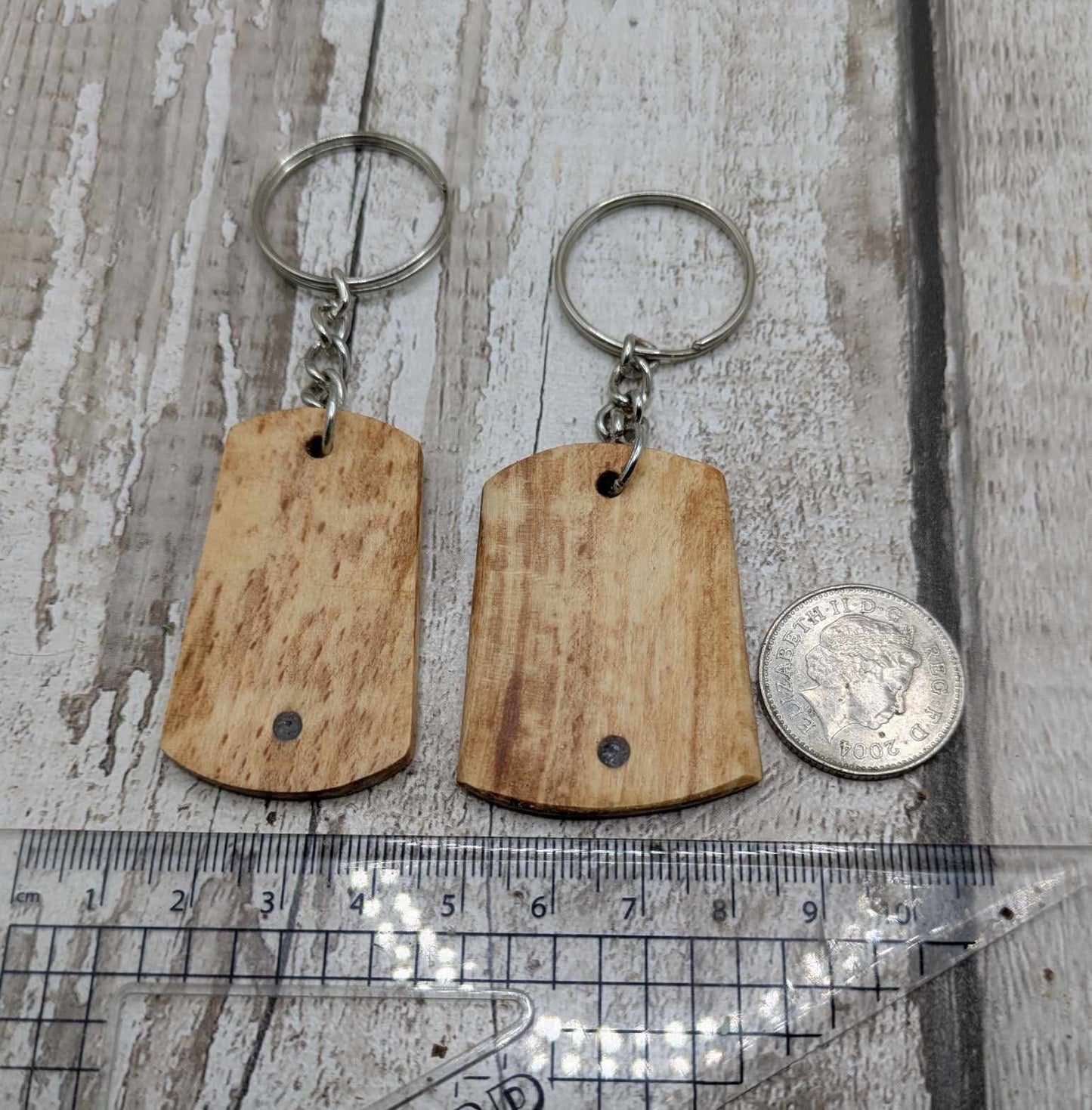 Beech wood keyrings and blue kyanite inlay.
