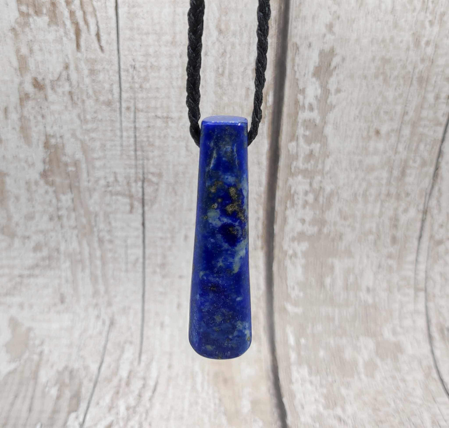 Lapis lazuli roimata drop stone pendant.