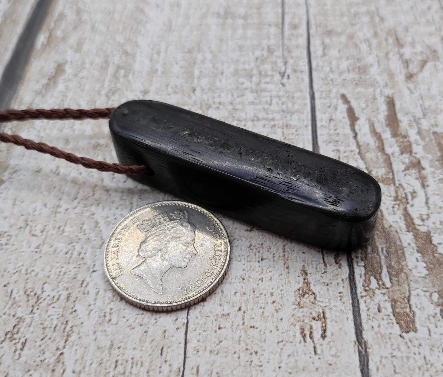 Bog oak and moldavite glass,