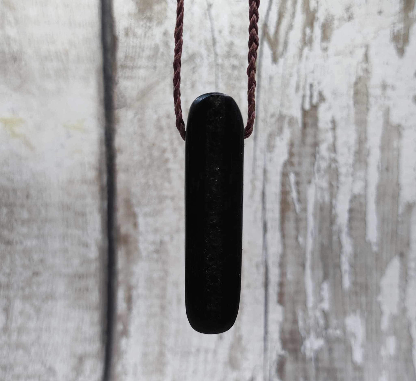 Bog oak and moldavite glass,
