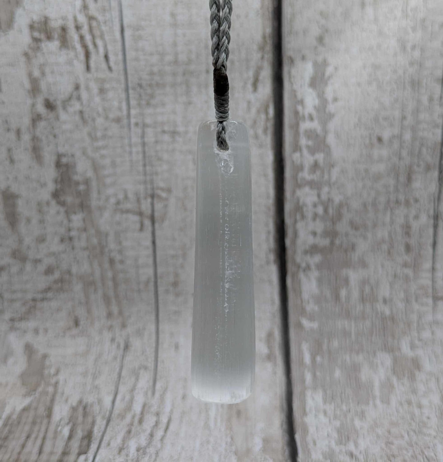 Selenite satin spar Toki pendant.