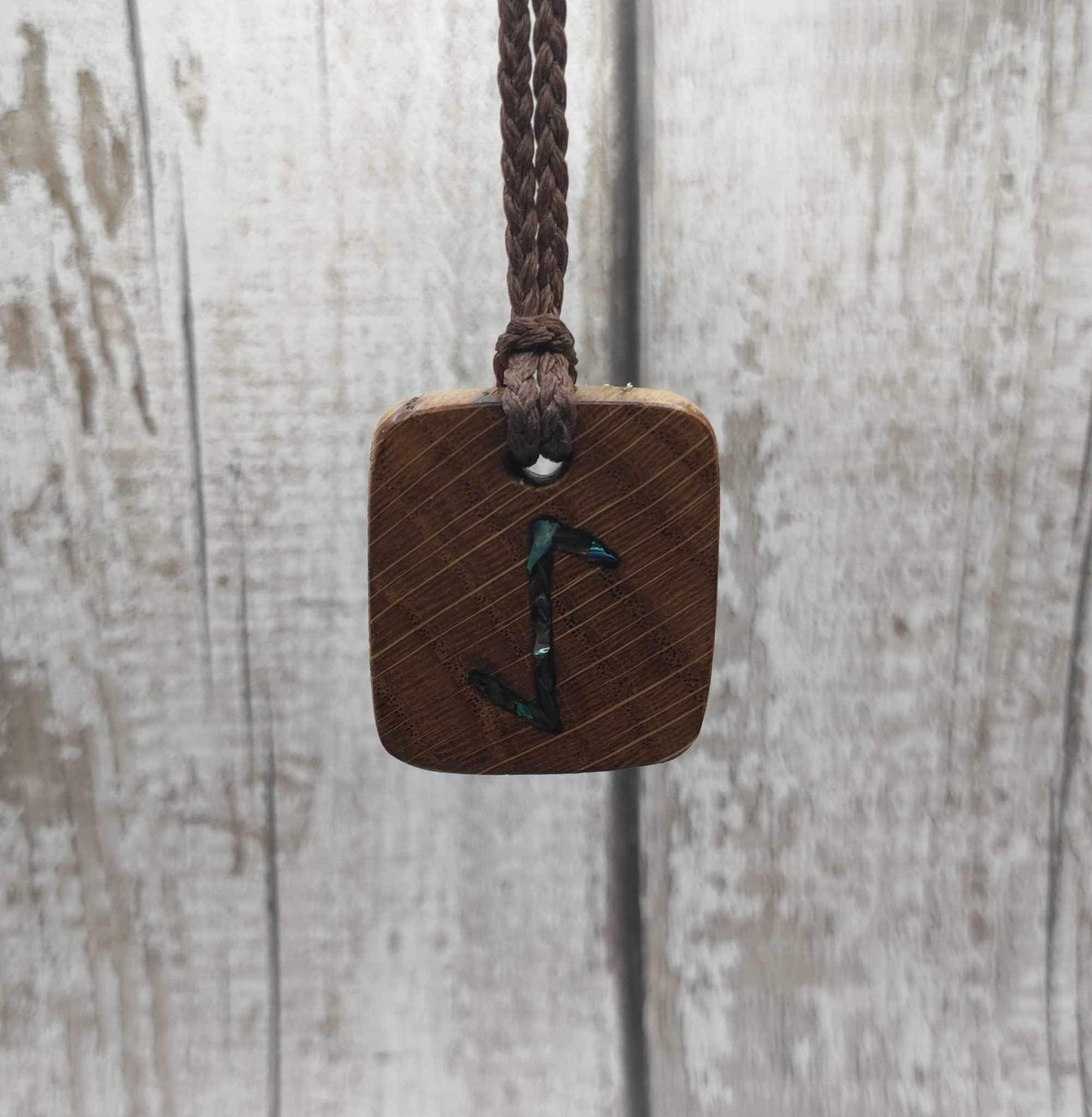 Eihwaz oak wood rune pendant with Pāua shell inlay.