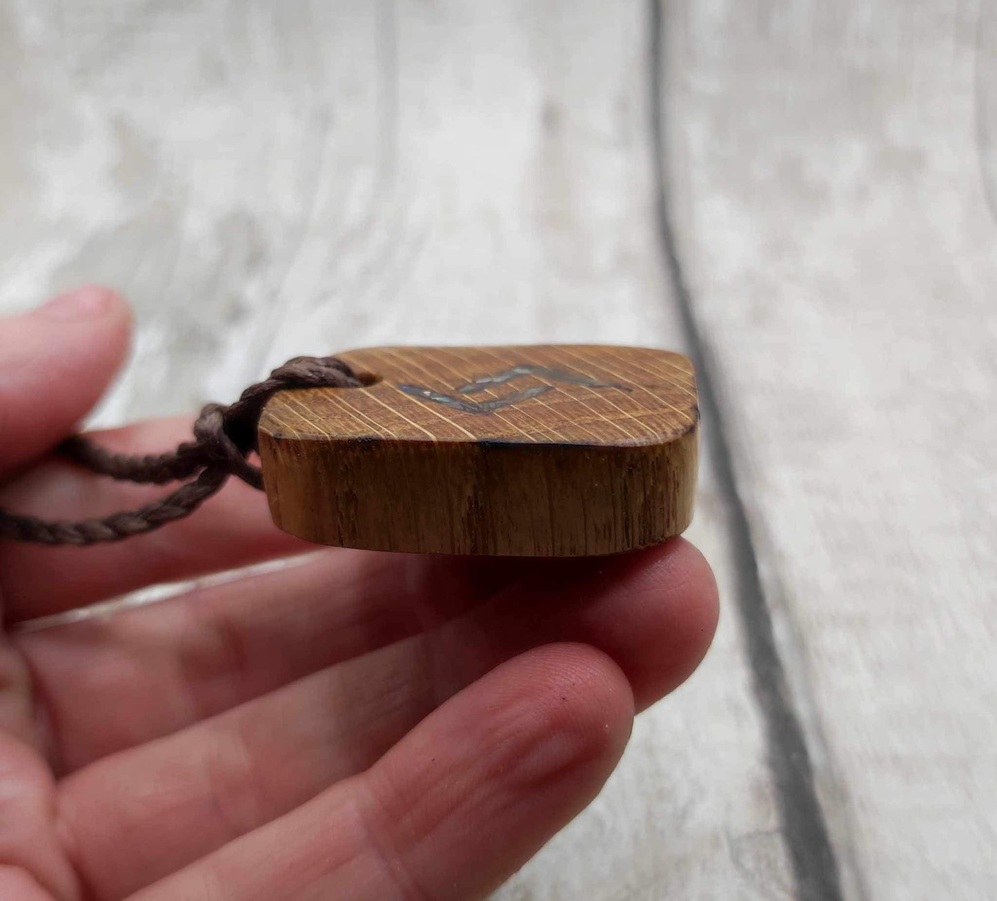 Oak wood jera Viking rune Christmas decoration with Pāua shell.