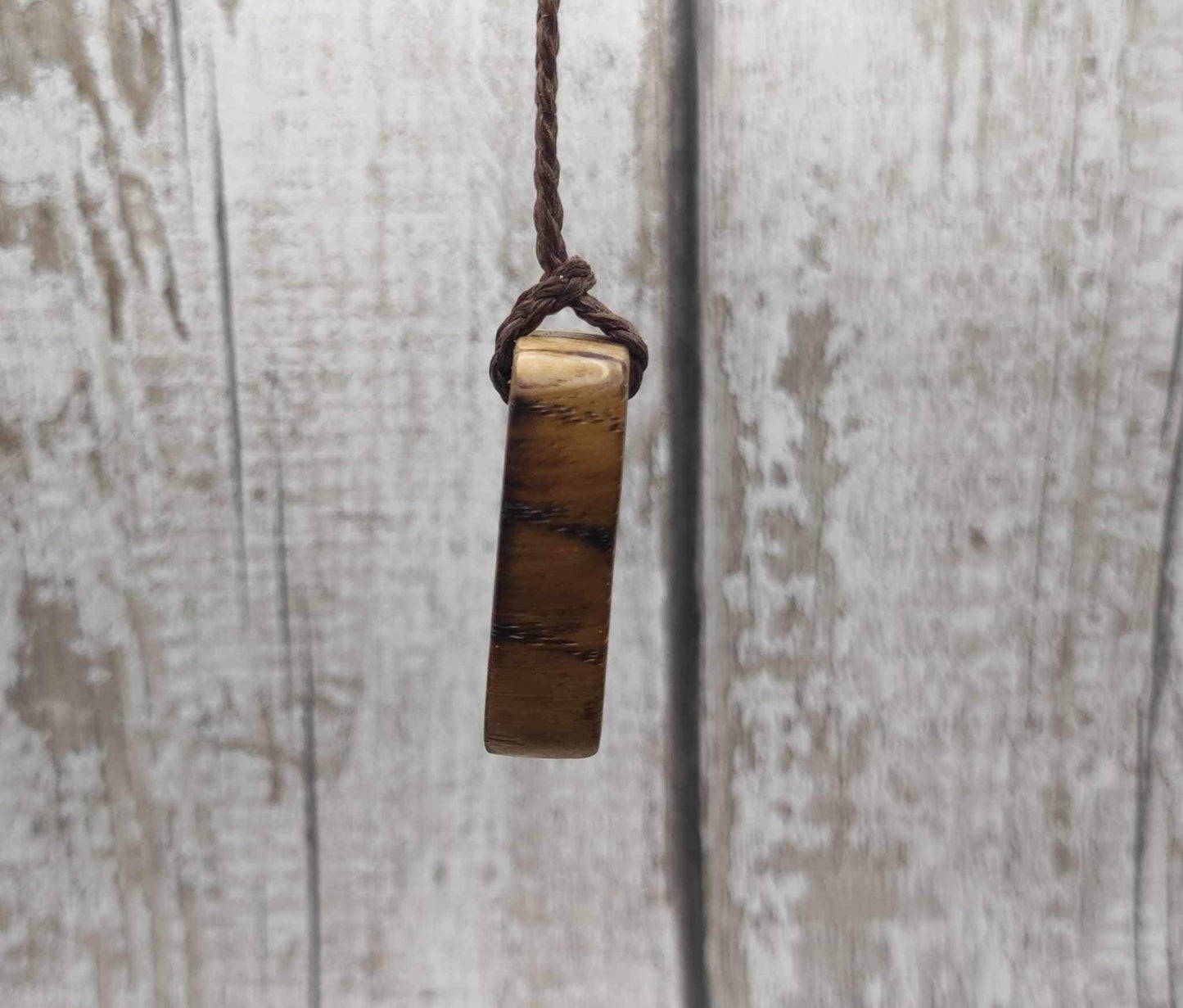 Eihwaz oak wood rune pendant with Pāua shell inlay.