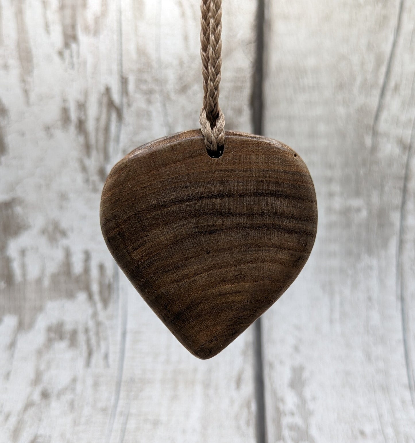 Birch wood Koru heart carved pendant.