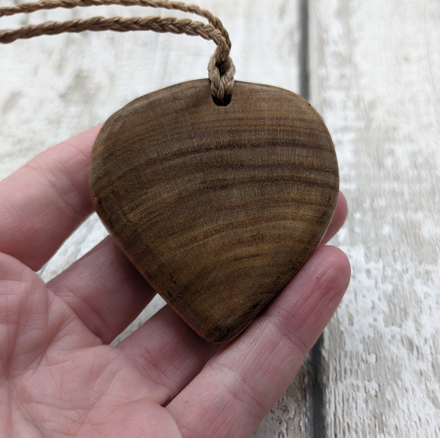 Birch wood Koru heart carved pendant.